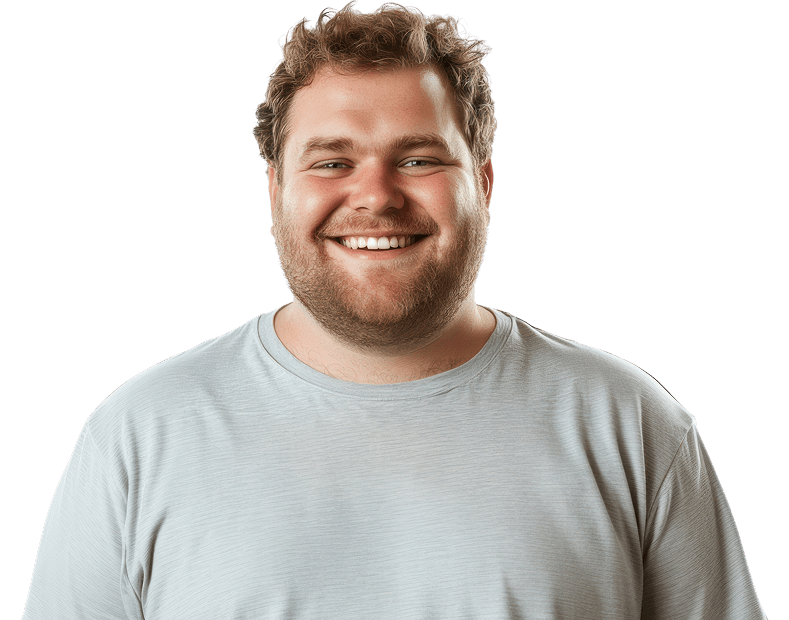 Young man in a grey t-shirt with a friendly, smiling face. He has a short beard and slightly curly short hair.